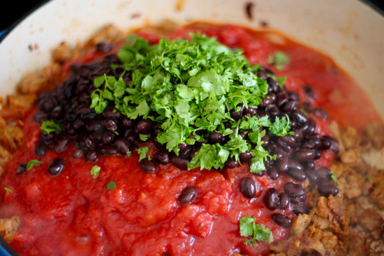 This one-pot Breakfast Casserole has an amazing Tex-Mex flavor with cumin and black beans, chipotle peppers and fried eggs right on top! | sarahnspice.com