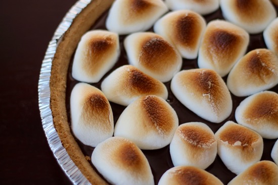 S'mores Pie is a decadent, chocolately, ooey gooey dessert that requires no campfire and only 4 ingredients! Chocolate lovers unite! | sarahnspice.com