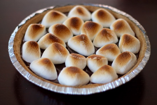 S'mores Pie is a decadent, chocolately, ooey gooey dessert that requires no campfire and only 4 ingredients! Chocolate lovers unite! | sarahnspice.com