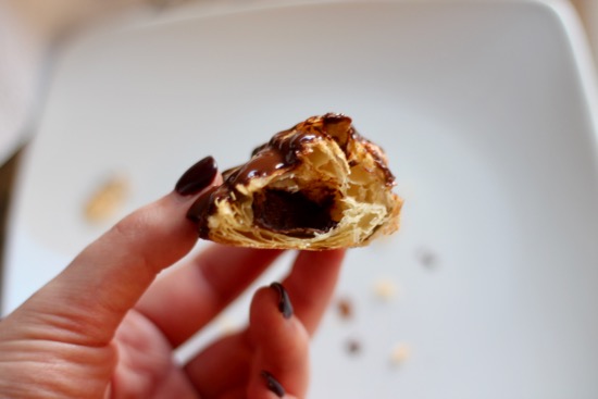 These Chocolate Hand Pies have a crispy, flaky pastry surrounding a smooth and creamy chocolate center, drizzled with even more chocolate! | sarahnspice.com