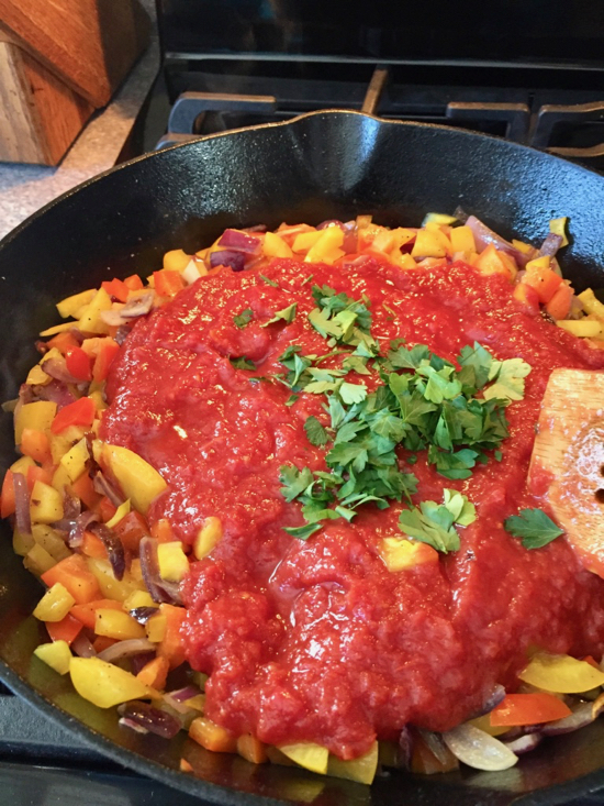Ratatouille is an array of colorful vegetables on top of a savory tomato sauce, baked to perfection. A hearty dish that's as tasty as it is stunning! | sarahnspice.com