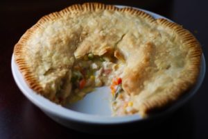 This weeknight Chicken Pot Pie recipe has a buttery, flaky crust surrounding a warm, creamy, dreamy gravy with tender chicken & veggies. What's not to love! | sarahnspice.com
